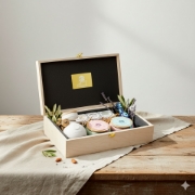 Lifestyle photo of the gift box with a custom ribbon and personalized gift card on a table