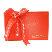 Red pine wooden gift box with a swing lid filled with Greek gourmet food products.