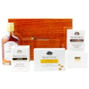Elenianna Chios mastiha luxury wooden box and its contents: mastiha powder, chewable tablets, lozenges, honey, and herbal mastiha liqueur. Authentic Greek wellness gift.