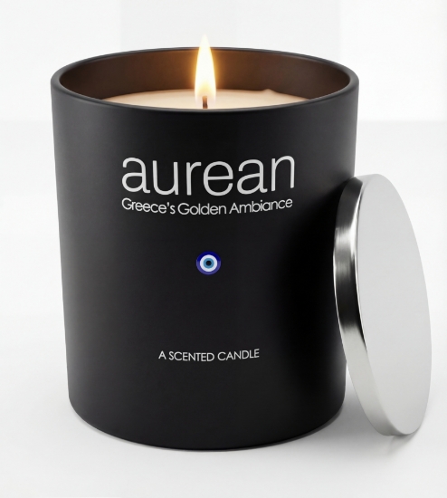 Close-up of Aurean Nox Luxury Candle in a matte black jar with a silver lid and the Greek evil eye emblem, illuminated by a warm flame.